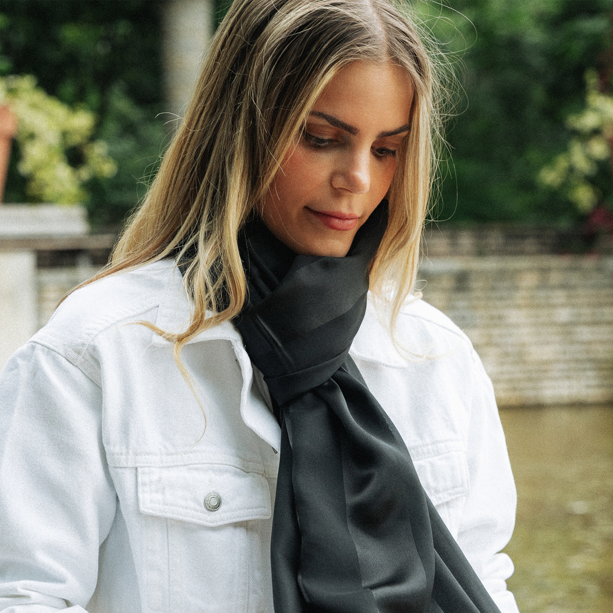 A large black silk ceremonial stole featuring chiffon and satin bands.